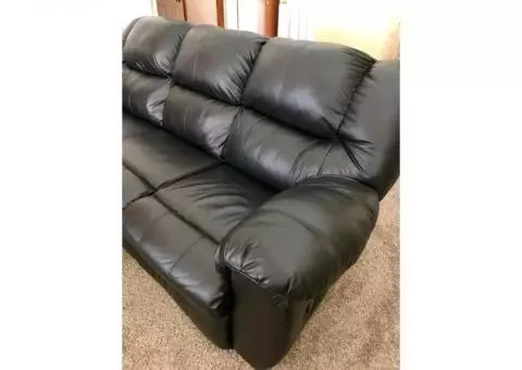 Black leather couch and love seat